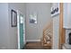 Foyer featuring wood floors, and bright blue front door, and a staircase at 205 Belvedere Green, Peachtree City, GA 30269