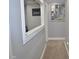 Bright hallway with neutral tones, carpet flooring, and stylish wall art creating an inviting space at 205 Belvedere Green, Peachtree City, GA 30269