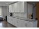 Spacious kitchen featuring granite countertops, white cabinetry and stainless steel hardware at 205 Belvedere Green, Peachtree City, GA 30269