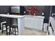 Basement kitchenette featuring modern appliances, white cabinetry, and sleek countertops, perfect for entertaining at 205 Belvedere Green, Peachtree City, GA 30269