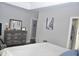 Spacious bedroom featuring a dresser and decoratively adorned walls at 205 Belvedere Green, Peachtree City, GA 30269
