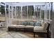 Inviting screened-in patio with comfortable seating and string lights, perfect for relaxing outdoors at 205 Belvedere Green, Peachtree City, GA 30269