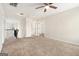 Carpeted loft with a ceiling fan and views to other rooms, perfect for relaxing at 1205 Heartwood Ave, Mcdonough, GA 30253