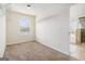 Walk-in closet with carpet, white shelving and racks, and a window providing natural light at 1205 Heartwood Ave, Mcdonough, GA 30253