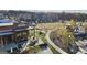 Aerial view of a community park with modern apartments, playground, and open green space, great for outdoor gatherings at 459 Lester Rd, Fayetteville, GA 30215