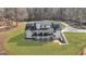 Aerial view of the home highlighting its spacious lot, surrounding trees, and architectural details at 459 Lester Rd, Fayetteville, GA 30215