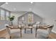 Cozy and bright sitting room features neutral paint, hardwood floors, and natural light from several windows at 459 Lester Rd, Fayetteville, GA 30215