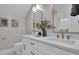 Bathroom featuring dual vanity sinks, marble countertops, and gold hardware accents at 459 Lester Rd, Fayetteville, GA 30215