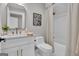 Bathroom featuring a vanity, mirror, and shower/tub combination with decorative touches at 459 Lester Rd, Fayetteville, GA 30215