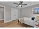 Bright bedroom featuring a bed, stylish ceiling fan, and natural light from the window at 459 Lester Rd, Fayetteville, GA 30215
