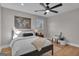 Comfortable bedroom with a bed, stylish ceiling fan, and natural light from the window at 459 Lester Rd, Fayetteville, GA 30215