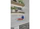 Close up of a lit coffee bar area with marble countertops, open shelving, and a built-in beverage cooler at 459 Lester Rd, Fayetteville, GA 30215