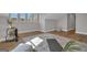 Exercise room featuring yoga mats, hardwood floors, and natural light from multiple windows at 459 Lester Rd, Fayetteville, GA 30215