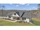 Stunning modern farmhouse with a beautiful lawn and lake view at 459 Lester Rd, Fayetteville, GA 30215