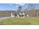 Picturesque view of the modern farmhouse with lake frontage at 459 Lester Rd, Fayetteville, GA 30215