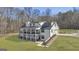 Beautiful exterior view of the home with multiple decks, showcasing its architectural design and landscaped yard at 459 Lester Rd, Fayetteville, GA 30215