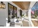 Inviting front porch with stylish seating and elegant lighting fixtures at 459 Lester Rd, Fayetteville, GA 30215