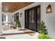Charming front porch featuring comfortable seating and a welcoming entrance at 459 Lester Rd, Fayetteville, GA 30215