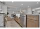 Kitchen with stainless steel appliances and hardwood floors, plus a view of the open floor plan at 459 Lester Rd, Fayetteville, GA 30215