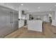 Spacious open kitchen features stainless steel appliances, a large island, and hardwood floors at 459 Lester Rd, Fayetteville, GA 30215