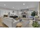 Inviting living room boasts an open layout with a fireplace, a neutral color palette, and hardwood floors at 459 Lester Rd, Fayetteville, GA 30215