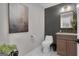 Modern powder room with stylish wallpaper, elegant fixtures, and contemporary decor at 459 Lester Rd, Fayetteville, GA 30215