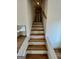 Staircase features hardwood steps and white risers and railings at 4163 Little Nw Spgs, Kennesaw, GA 30144