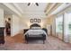 Large carpeted main bedroom with three paneled accent wall, ceiling fan and private ensuite at 7163 Walton Reserve Ln, Austell, GA 30168