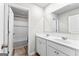 Bright bathroom features dual sinks, white cabinets and wide mirror, plus shower and tub combo at 755 Gelderland Dr, Hampton, GA 30228