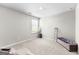 Bright bedroom features a large window, carpet, and decorative accents at 755 Gelderland Dr, Hampton, GA 30228