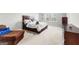 This well-lit bedroom showcases a comfortable bed, natural lighting, and inviting decor at 755 Gelderland Dr, Hampton, GA 30228