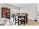 Bright dining area with large table, seating for eight, and a large window at 755 Gelderland Dr, Hampton, GA 30228