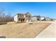 A view of several attractive homes in a well-kept neighborhood under a bright sky at 755 Gelderland Dr, Hampton, GA 30228