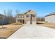 Beautiful brick two-story home with a two-car garage and well-maintained lawn at 755 Gelderland Dr, Hampton, GA 30228