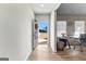 Bright entryway with hardwood floors, open to a light-filled office space at 755 Gelderland Dr, Hampton, GA 30228