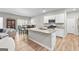Modern kitchen with granite countertops, stainless steel appliances, and a center island at 755 Gelderland Dr, Hampton, GA 30228
