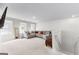 The upper landing showcases a neutral living room with a large, comfortable sectional couch at 755 Gelderland Dr, Hampton, GA 30228