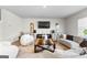 Comfortable living room with contemporary decor, plush seating, a fireplace, and a large TV at 755 Gelderland Dr, Hampton, GA 30228