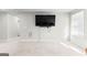 A spacious living room features a mounted TV and ample natural light from a window at 755 Gelderland Dr, Hampton, GA 30228