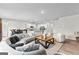 Open-concept living space with a kitchen, dining area, and comfortable seating, all bathed in natural light at 755 Gelderland Dr, Hampton, GA 30228