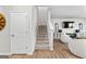 Carpeted stairs lead to a second level with a glimpse of the living room at 755 Gelderland Dr, Hampton, GA 30228
