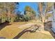 Expansive backyard with a patio and trees, ideal for outdoor activities and relaxation at 6071 Cristie Dr, Ellenwood, GA 30294