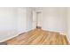 A bright bedroom featuring wood-look floors and a double-door closet at 6071 Cristie Dr, Ellenwood, GA 30294