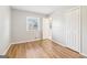 Bedroom featuring a window, closet, and light-colored wood-look floors at 6071 Cristie Dr, Ellenwood, GA 30294