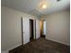 Bedroom featuring plush carpet, and two closet doors at 5425 Twin Lakes Dr, Atlanta, GA 30349