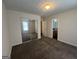 Spacious bedroom with plush carpeting and a large mirrored closet at 5425 Twin Lakes Dr, Atlanta, GA 30349