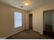 Cozy bedroom with plush carpet, window, and closet at 5425 Twin Lakes Dr, Atlanta, GA 30349