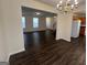 Open dining area with wood floors and clear view of the kitchen and living room at 5425 Twin Lakes Dr, Atlanta, GA 30349