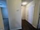 Hallway featuring hardwood floors, closet, and doorways to other rooms at 5425 Twin Lakes Dr, Atlanta, GA 30349