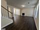 Open-concept living room with dark hardwood floors, fireplace, and ample natural light at 5425 Twin Lakes Dr, Atlanta, GA 30349